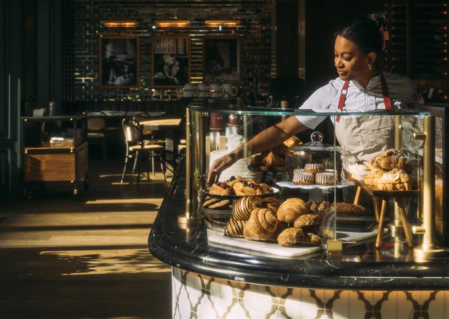 A plate of pastries alongside some coffee